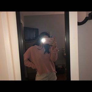 pink fuzzy sweater with wrist detail